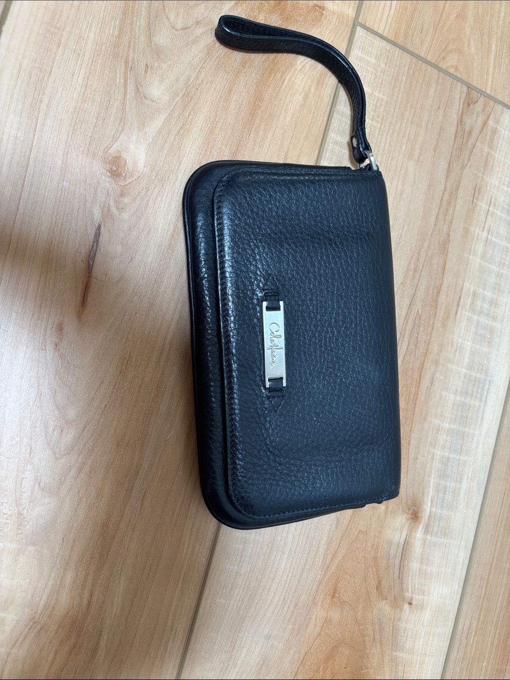 Cole Haan Black Pebbled Leather Wristlet with Silver Plaque